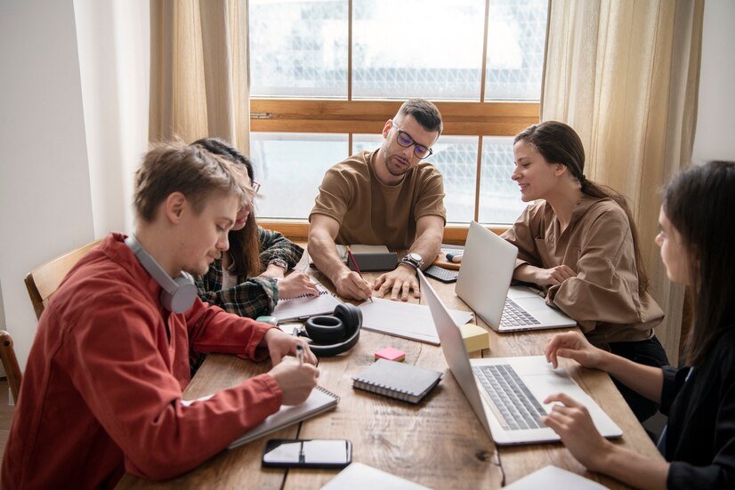 colleagues-using-laptops-notebooks-learning-study-session_23-2149285389